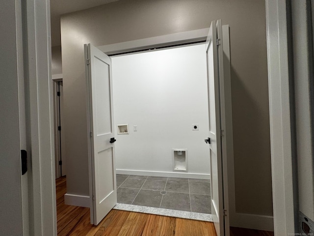 clothes washing area with hookup for an electric dryer and hardwood / wood-style floors