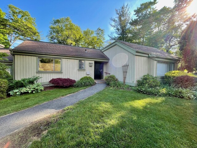 view of front of property with a front lawn