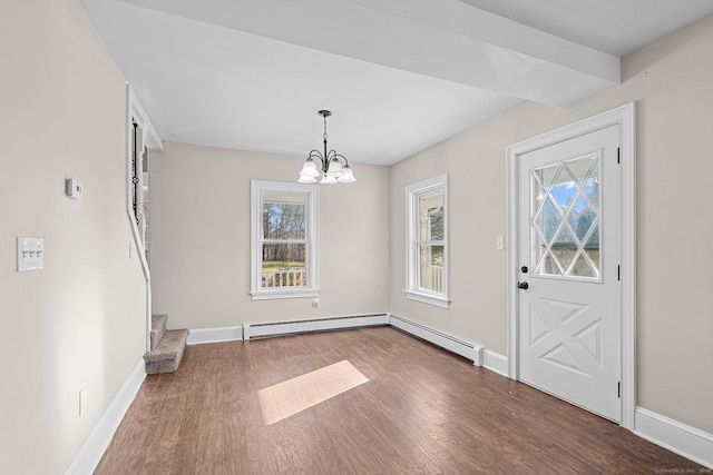 entrance foyer featuring a baseboard radiator, dark wood-type flooring, and a notable chandelier