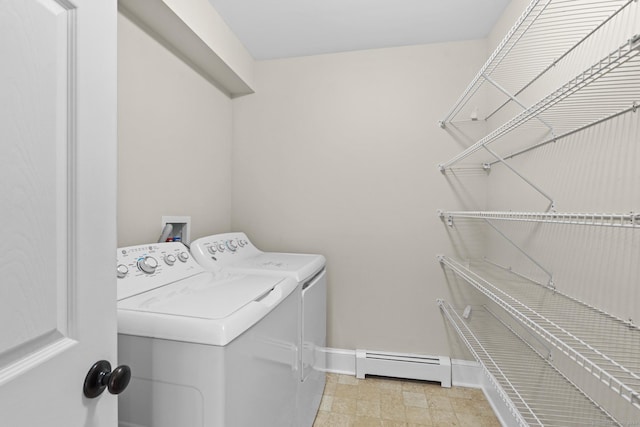 washroom with washer and dryer and a baseboard radiator