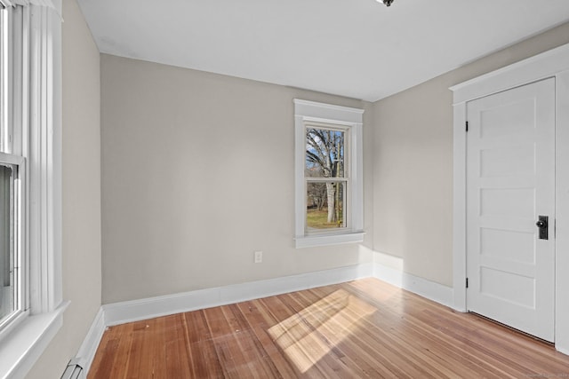 unfurnished room with light hardwood / wood-style floors