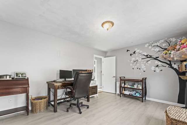 home office featuring light hardwood / wood-style flooring