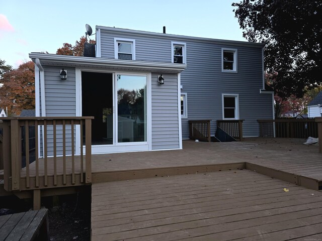 rear view of property with a wooden deck