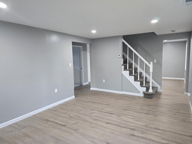 spare room featuring light hardwood / wood-style floors