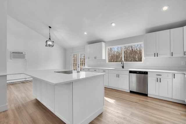 kitchen with dishwasher, lofted ceiling, decorative light fixtures, a kitchen island, and white cabinetry