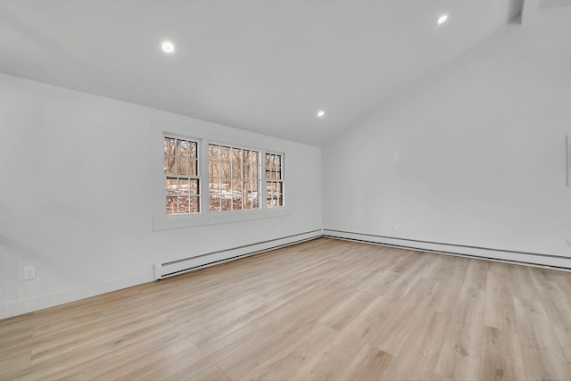 unfurnished room with light hardwood / wood-style floors and vaulted ceiling