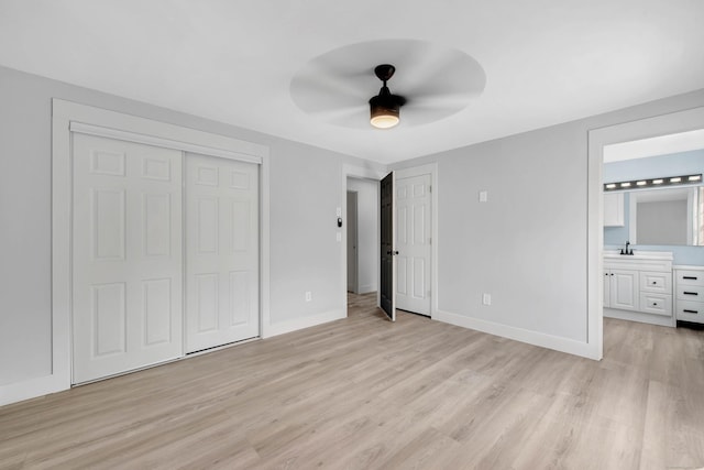 unfurnished bedroom with light hardwood / wood-style floors, ensuite bath, and ceiling fan