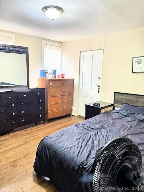 bedroom with light hardwood / wood-style floors