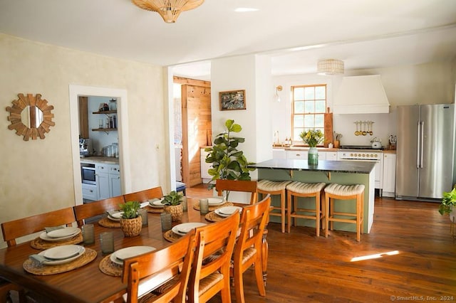 dining room featuring dark hardwood / wood-style flooring