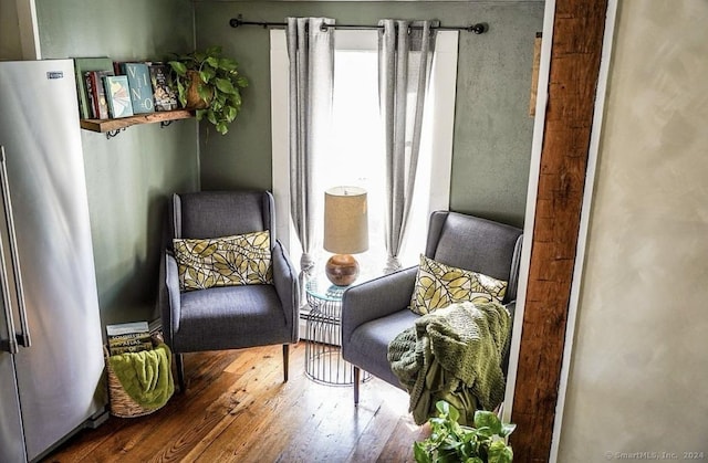 sitting room with hardwood / wood-style floors