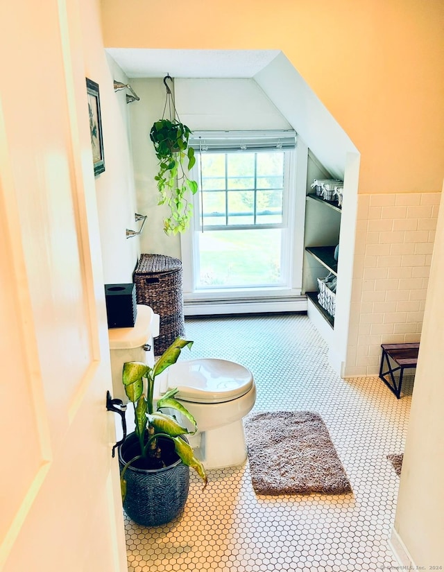 bathroom featuring toilet, a baseboard radiator, and tile patterned floors