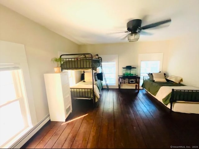 unfurnished bedroom with a baseboard radiator, dark hardwood / wood-style floors, and ceiling fan