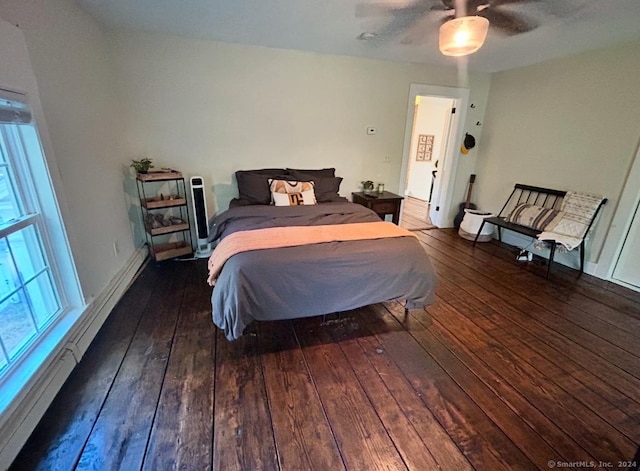 bedroom with ceiling fan and dark hardwood / wood-style floors