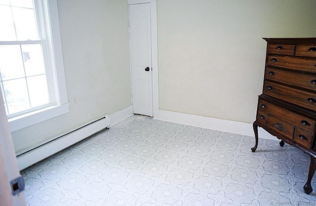 bedroom featuring a baseboard radiator