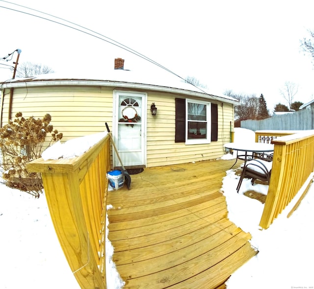 view of snow covered deck