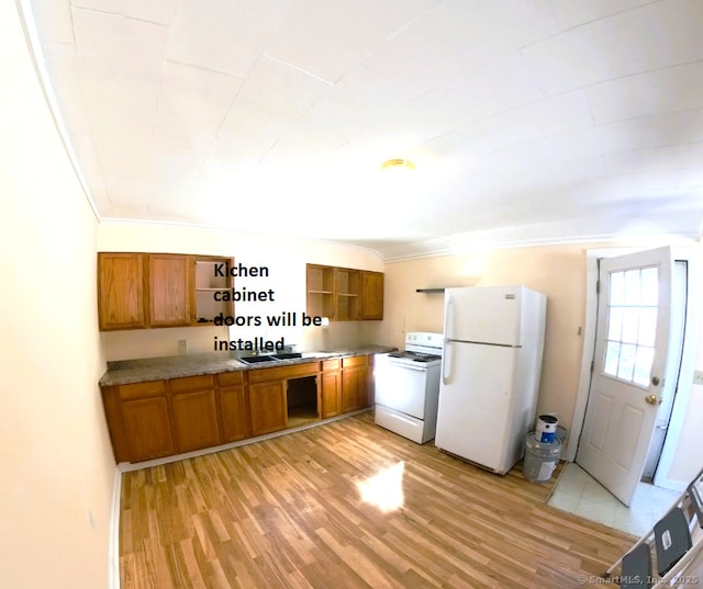 kitchen with white appliances, brown cabinets, light countertops, light wood-style floors, and open shelves