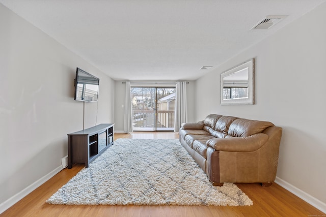 living room with light hardwood / wood-style floors