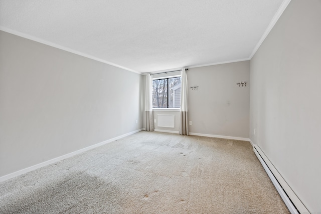 spare room featuring light colored carpet, ornamental molding, a textured ceiling, and a baseboard heating unit