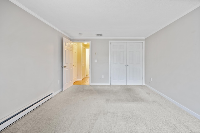 unfurnished bedroom with a baseboard radiator, crown molding, a closet, and light colored carpet