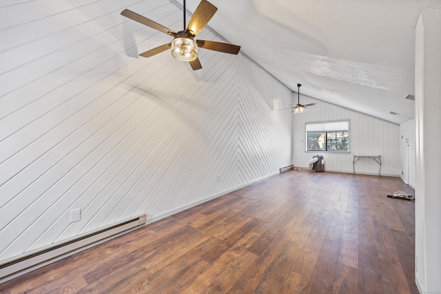 unfurnished living room with ceiling fan, vaulted ceiling, wood-type flooring, and a baseboard heating unit