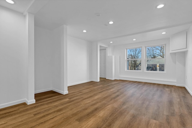 unfurnished living room with wood-type flooring