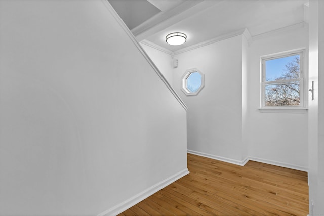 entrance foyer featuring light wood-type flooring and crown molding