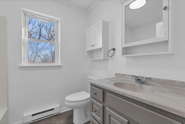 bathroom with vanity, baseboard heating, crown molding, tile patterned flooring, and toilet