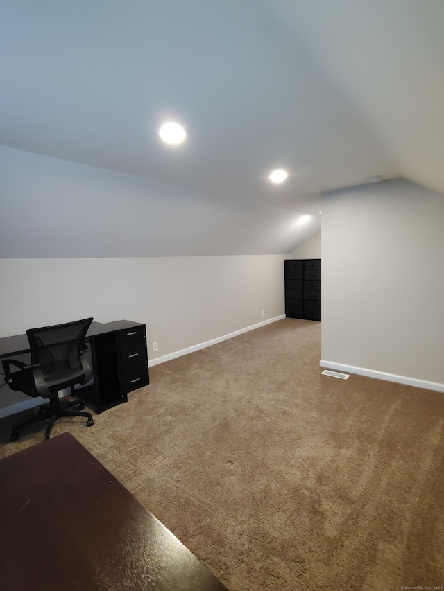 office area featuring carpet flooring and lofted ceiling