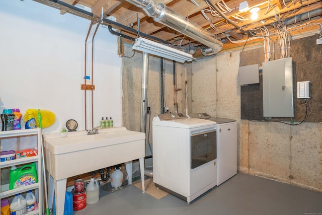 basement with washer and dryer, sink, and electric panel