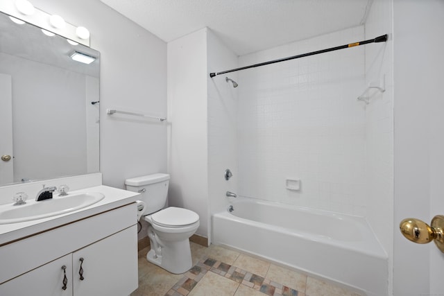 full bathroom with tile patterned floors, vanity, a textured ceiling, toilet, and tiled shower / bath