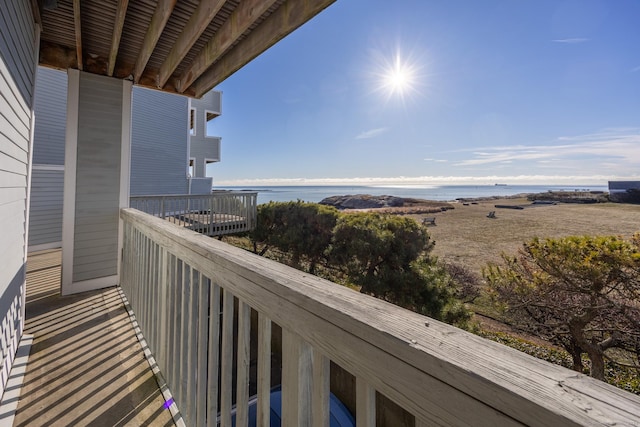 balcony featuring a water view