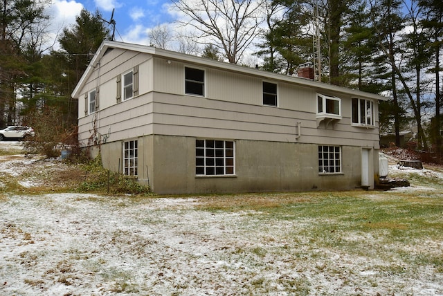 view of snow covered house