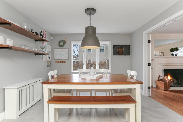 dining area with light tile patterned floors