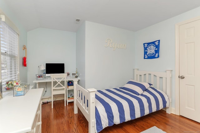 bedroom featuring dark hardwood / wood-style flooring