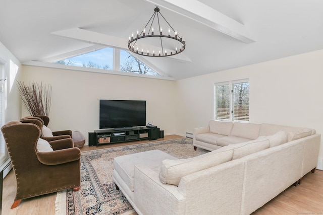 living room with baseboard heating, a notable chandelier, light wood-type flooring, and vaulted ceiling with beams