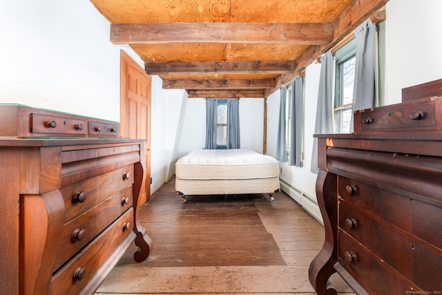 bedroom with beamed ceiling, dark hardwood / wood-style floors, and a baseboard radiator