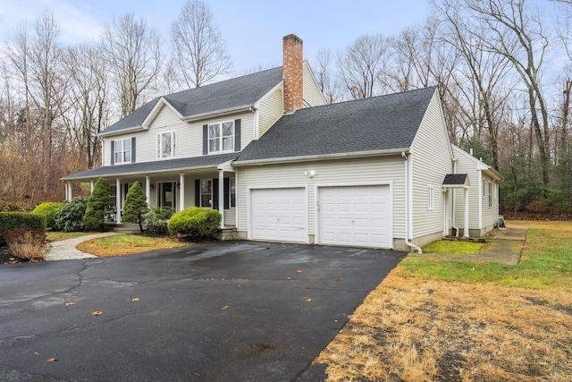 view of front of house featuring covered porch and a garage