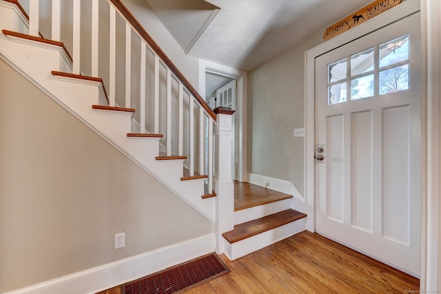 foyer entrance featuring light hardwood / wood-style flooring