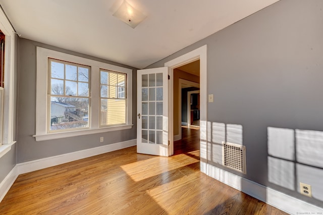 interior space featuring french doors and light hardwood / wood-style flooring