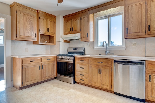 kitchen with ceiling fan, sink, and stainless steel appliances