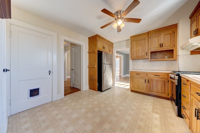 kitchen with appliances with stainless steel finishes and ceiling fan