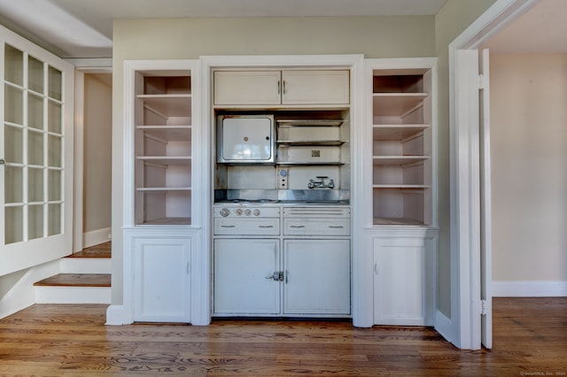 interior space featuring hardwood / wood-style floors and cream cabinets