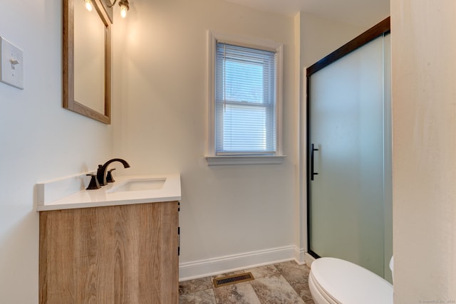 bathroom featuring tile patterned flooring, vanity, and toilet