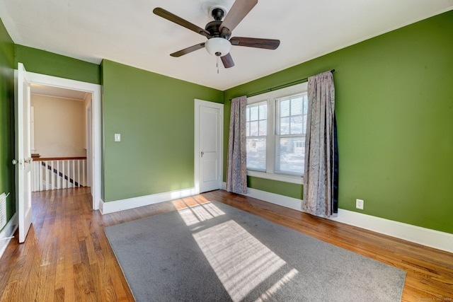 unfurnished bedroom with hardwood / wood-style floors and ceiling fan