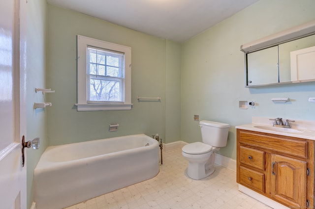 bathroom with vanity, toilet, and a tub to relax in