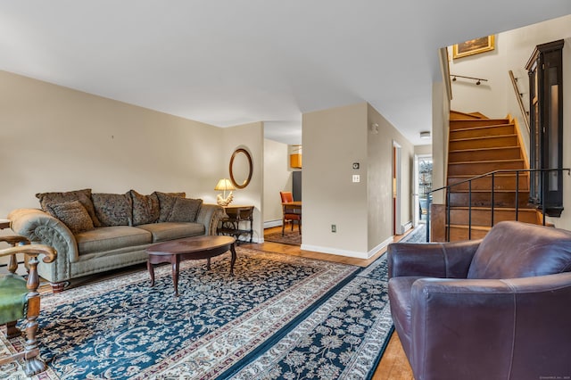 living room with hardwood / wood-style flooring and baseboard heating