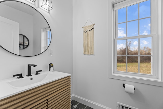 bathroom with vanity and tile patterned flooring