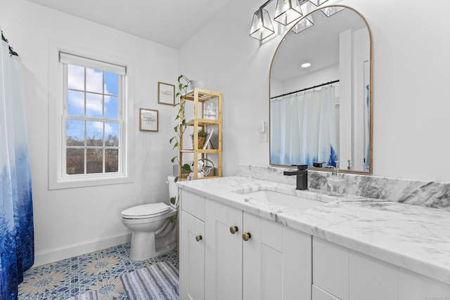 bathroom with tile patterned floors, toilet, and vanity