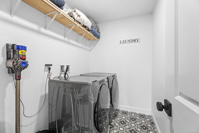 washroom featuring washer and clothes dryer