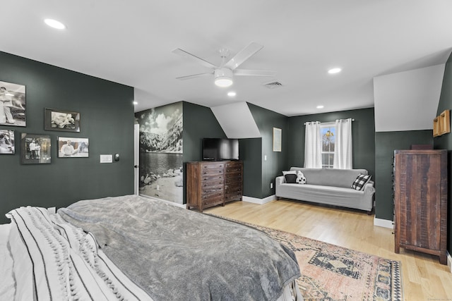 bedroom with ceiling fan and light hardwood / wood-style flooring